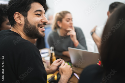 Portrait of young man at his workplace.