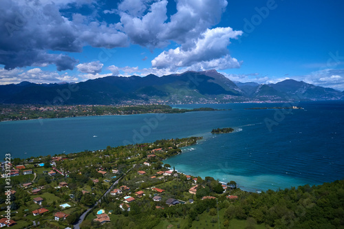 Panoramic view of the island of San Biagio  Italy. Lake Garda  blue sky