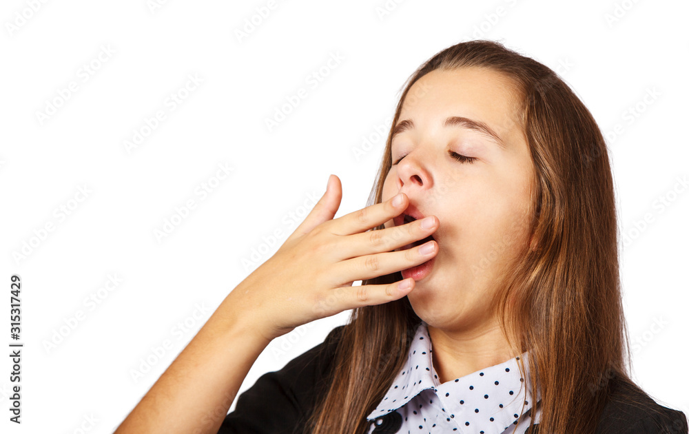 teen girl yawns covering her mouth with her hand teen girl yawns covering her mouth with her hand