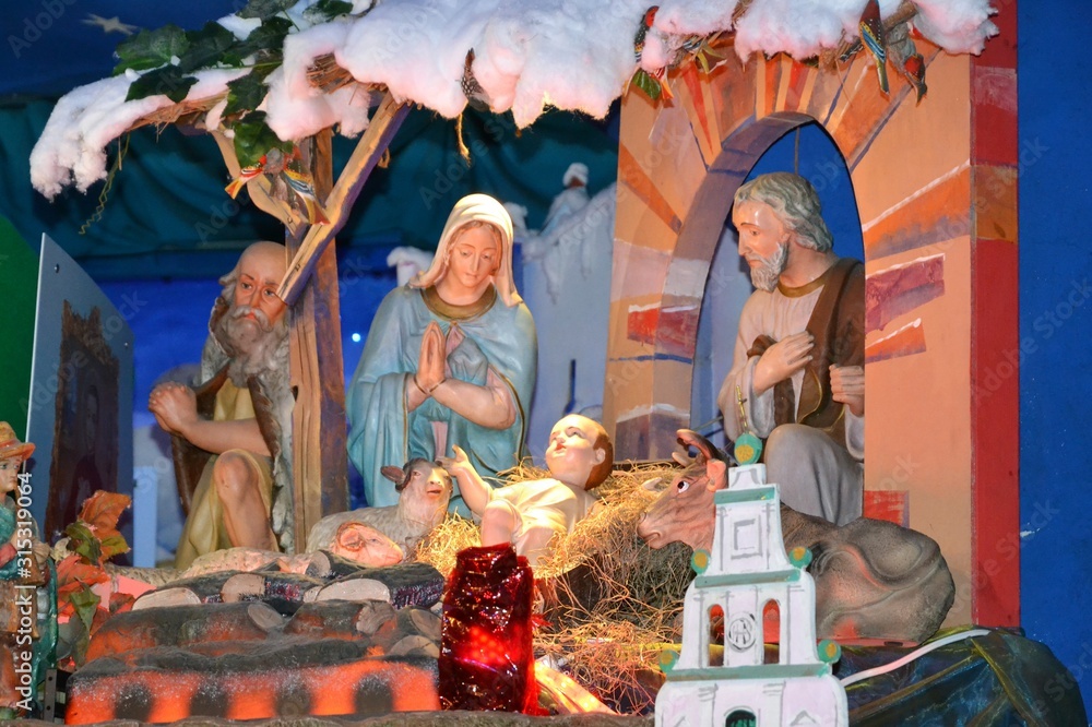 Details od moving Nativity Scene. Christmas crib in the crypt of Capuchin church on Miodowa street, Warsaw, Poland.