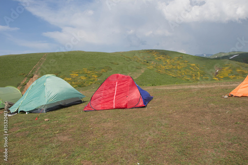 family camping tent with mountains on background. vacation  nature concept