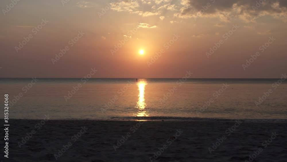 Stand Up Paddle Boards Silhouette on Water at sunset in Andaman Sea, thailand Stand Up Paddle Boards Silhouette on Water at sunset in Andaman Sea, thailand