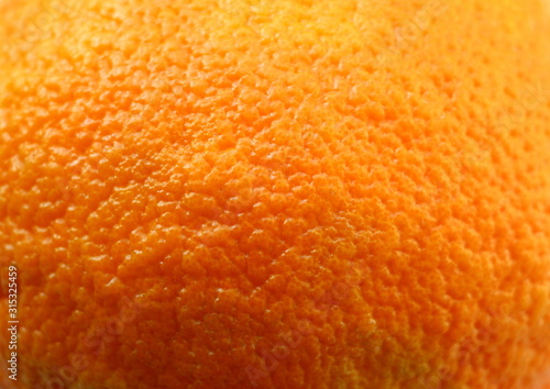 Orange peel. Vitamins Citrus. The fruit. Orange background Natural product. Pores. Cellulitis Obesity.