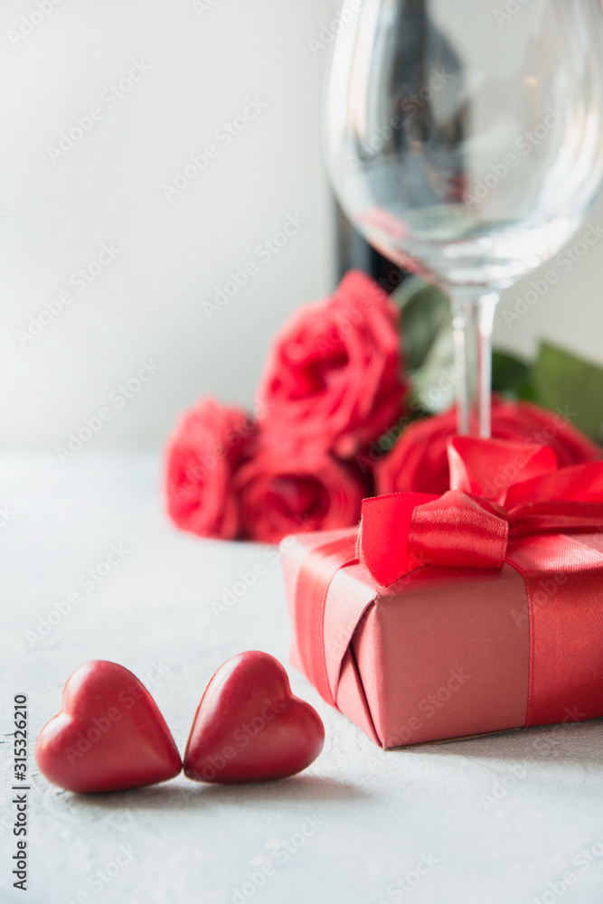 Romantic red gift with swees and red wine. Valentine day greeting card.