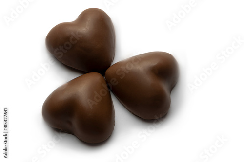 Heart shaped chocolates isolated on a white background. Valentine day concept.