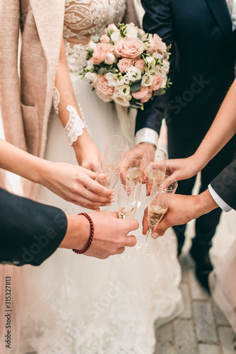 bride and groom with their friends celebrating their wedding