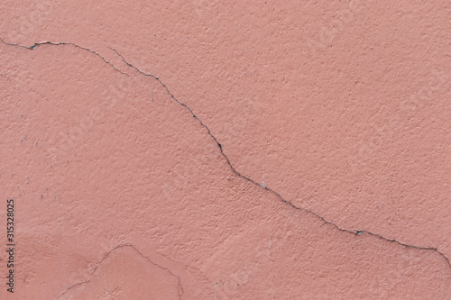 cracked line on  pink wall