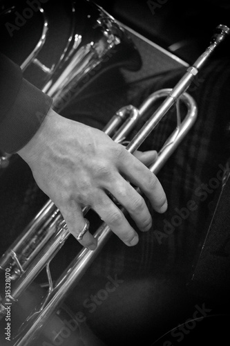Trumpeter's hand, vintage effect, close up, monochrome