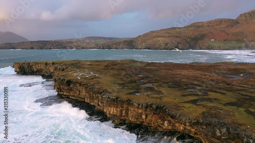 Huge waves breaking at Muckross Head - A small peninsula west of Killybegs, County Donegal, Ireland. The cliff rocks are famous for climbing photo