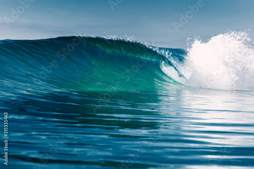 Fototapeta Naklejka Na Ścianę i Meble -  Barrel wave for surfing in ocean. Breaking transparent wave