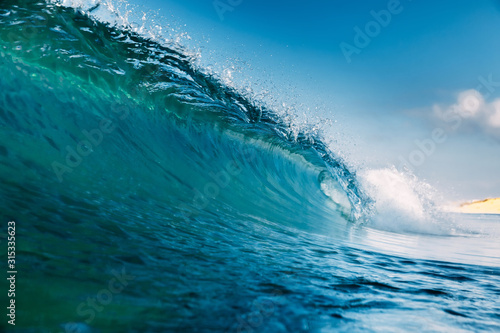 Barrel wave for surfing in ocean. Breaking transparent wave