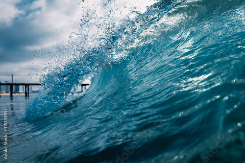 Barrel wave for surfing in ocean. Breaking transparent wave