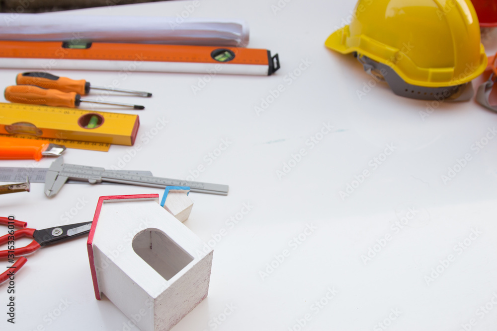 Desk of Architectural working project in construction site,With drawing equipment.Architectural concept