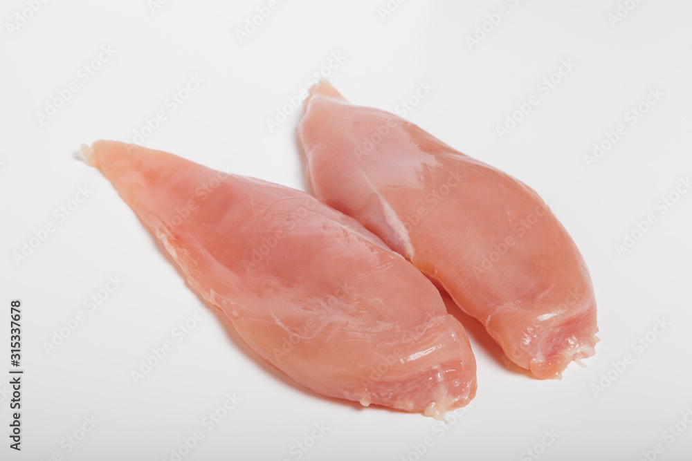 Raw chiken meat on a light background Raw chiken meat on a light background
