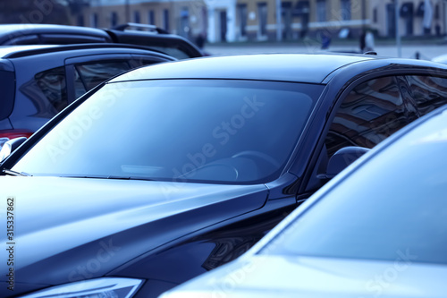 Closeup view of new modern car outdoors photo