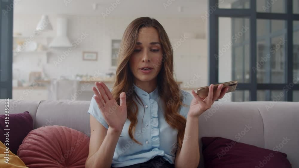 Focused business woman making phone call at home office. Lady speaking phone. Focused business woman making phone call at home office. Lady speaking phone.