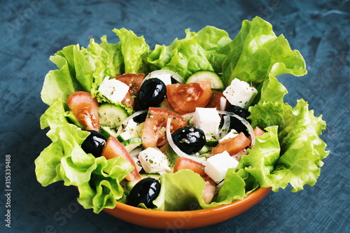 fresh salad with cheese and black olives