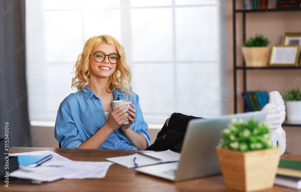 happy young business woman at home office working on computer. happy young business woman at home office working on computer.