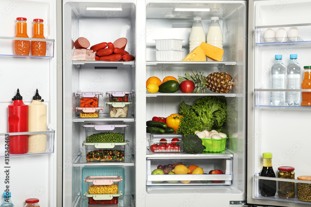 Open refrigerator full of different fresh products Open refrigerator full of different fresh products