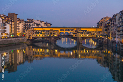 The Ponte Vecchio, famous medieval stone bridge over the Arno River in Florence, Tuscany, Italy. © nikitos77