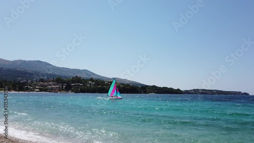 Wallpaper Mural Windsurfing and catamaran on Ionian Sea Corfu Windsurf Surfing The Wind On Waves, Recreational Water Sports view from the beach Torontodigital.ca