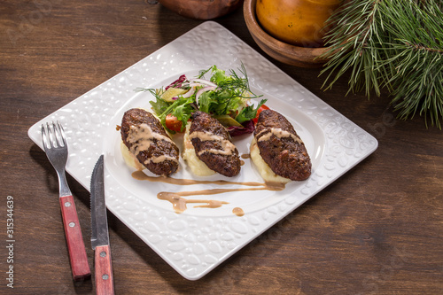 Fototapeta Naklejka Na Ścianę i Meble -  Beef Meat Balls or Rissole with mashed potato on wooden table