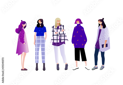 Women dressed in trendy fashion clothes standing together