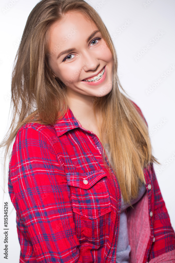 Portrait of teen girl showing dental braces. Portrait of teen girl showing dental braces.