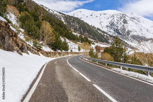 Panoramic road view and winter snow landscape mountain view in Andorra, Pyrenees mountains, South Europe. Andorra is famous tourist travel destination. Luxury amazing resort for skiing and winter rest