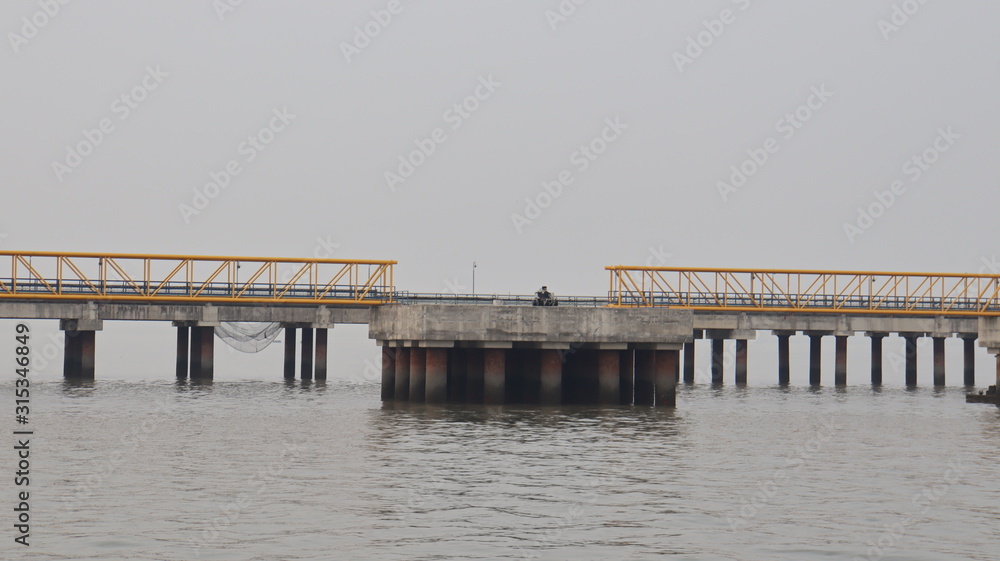 Mumbai, Maharastra/India- January 13 2019: Bridges connecting a  floating platform located near the sea port.