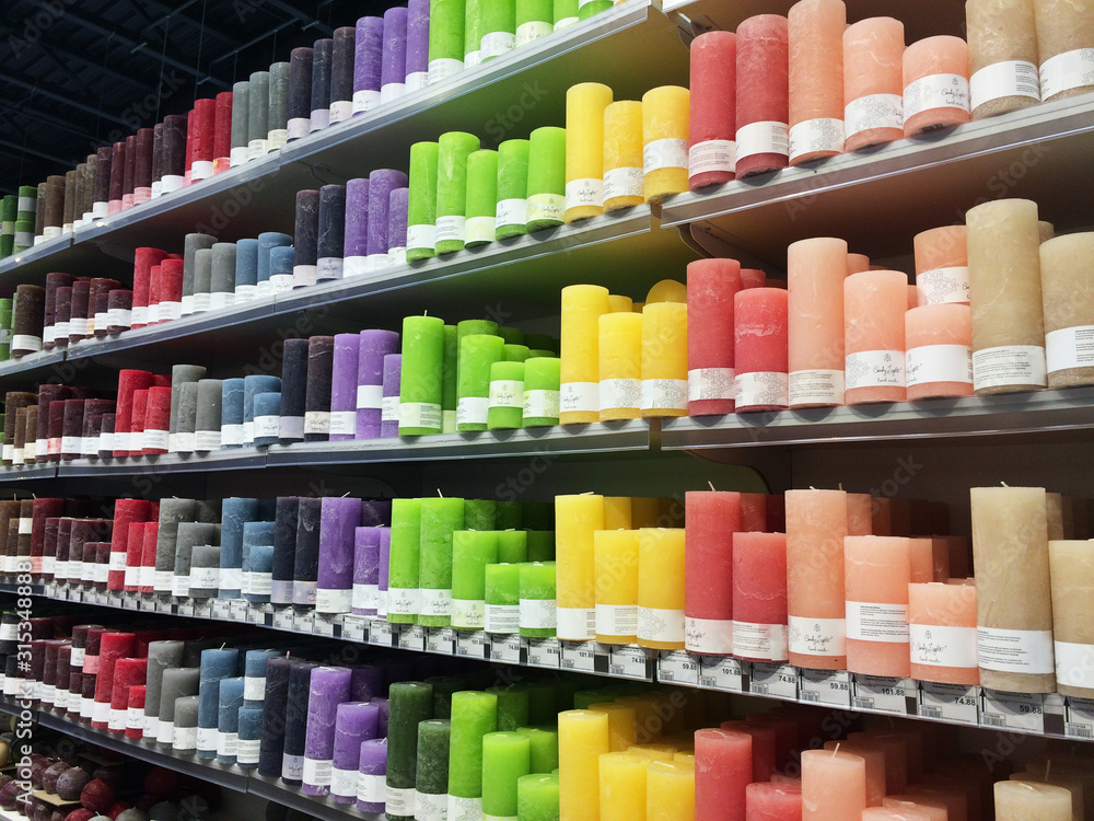KYIV, UKRAINE - DECEMBER 20, 2019: Supermarket in Kiev. Multicolor store front or supermarket with decorative candles -  shopping, sale, consumerism aconcept. Aromatic colorful new candles in a row.
