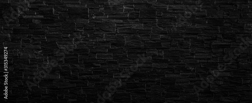 Old black brick wall texture background,brick wall texture for for interior or exterior design backdrop,vintage dark tone.