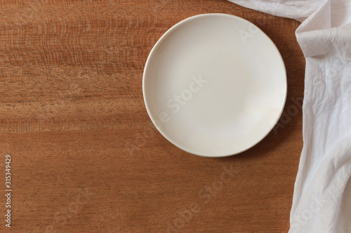 Patterned texture of wood and white plates