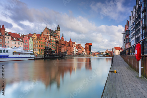 Beautiful scenery of the old town in Gdansk over Motlawa river at dawn, Poland.