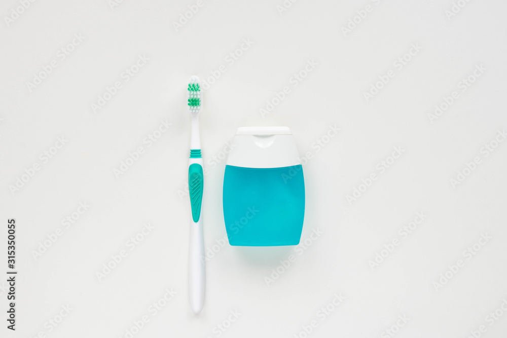 Toothbrushes and hygiene products on a white background. Top view. Toothbrushes and hygiene products on a white background. Top view.