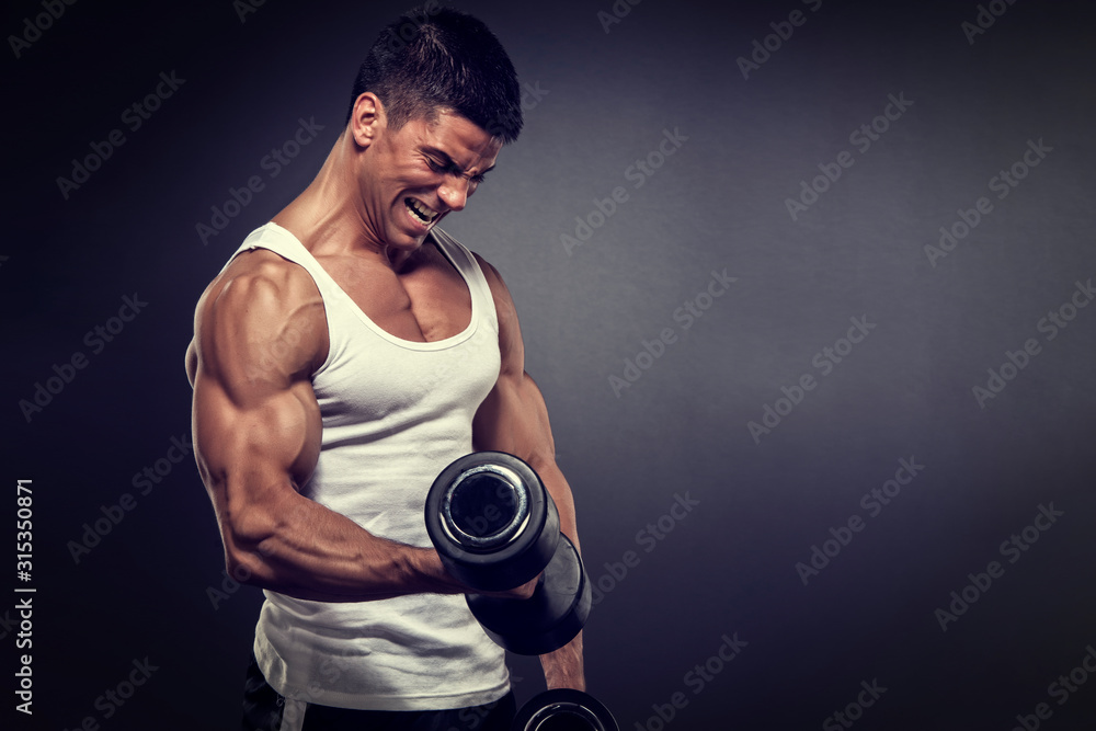 Muscular Handsome Men Lifting Weights. Bodybuilder performing Dumbbell Bicep Curls Muscular Handsome Men Lifting Weights. Bodybuilder performing Dumbbell Bicep Curls