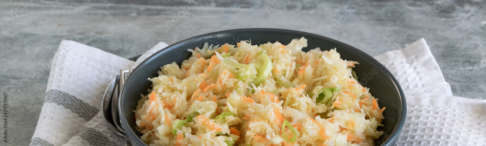 Fresh salad of raw cabbage, leeks and carrots, multivitaminico natural food Fresh salad of raw cabbage, leeks and carrots, multivitaminico natural food