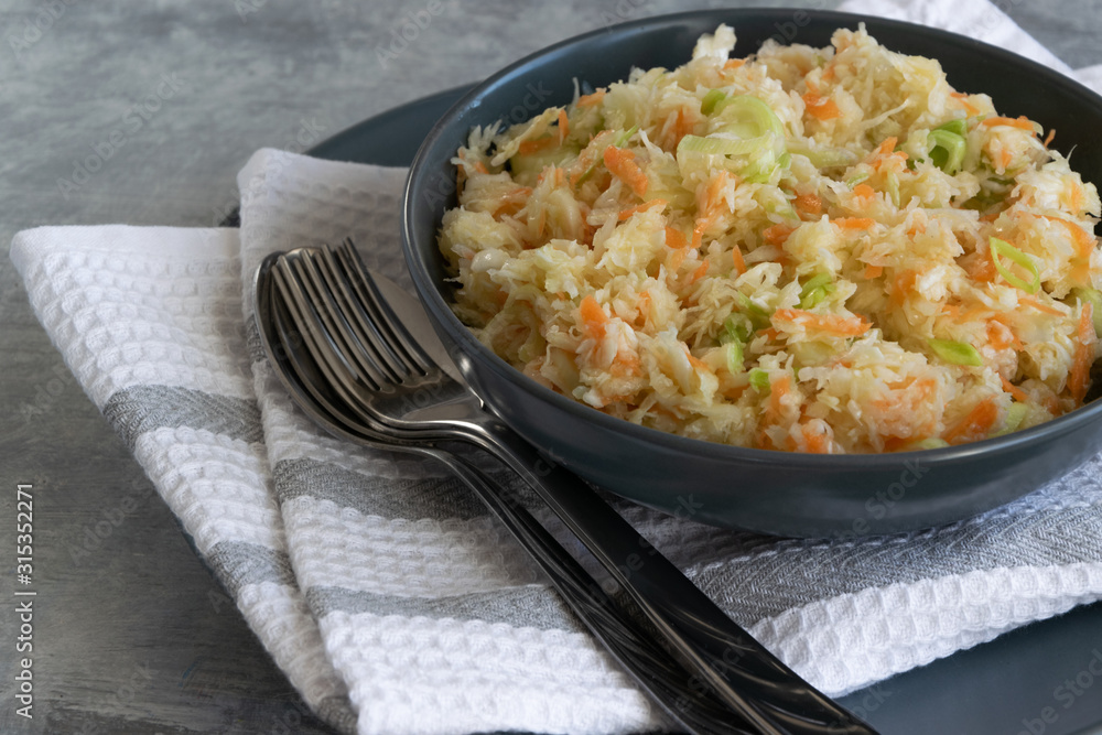 Fresh salad of raw cabbage, leeks and carrots, multivitaminico natural food Fresh salad of raw cabbage, leeks and carrots, multivitaminico natural food