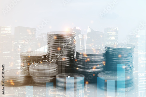 Double exposure of city view , diagram bar and line graph , rows of coins for finance , money , investment and business concept background