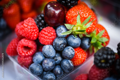 fresh berries close up - strawberries  blueberries  red berries  raspberry  black berries 