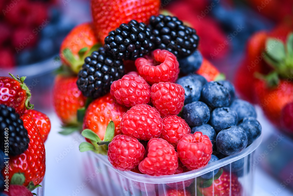 fresh berries close up - strawberries, blueberries, red berries, raspberry, black berries fresh berries close up - strawberries, blueberries, red berries, raspberry, black berries