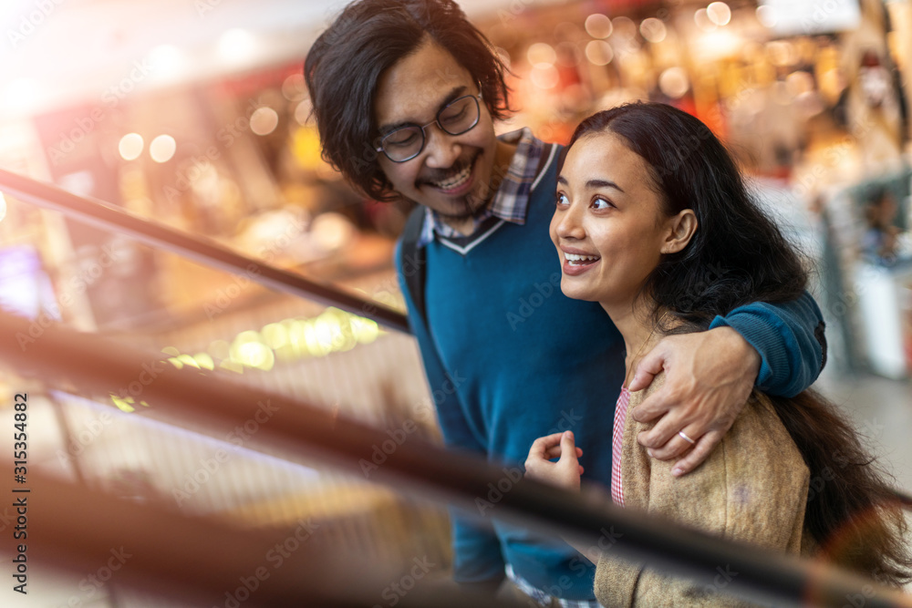 Happy young couple in shopping mall Happy young couple in shopping mall