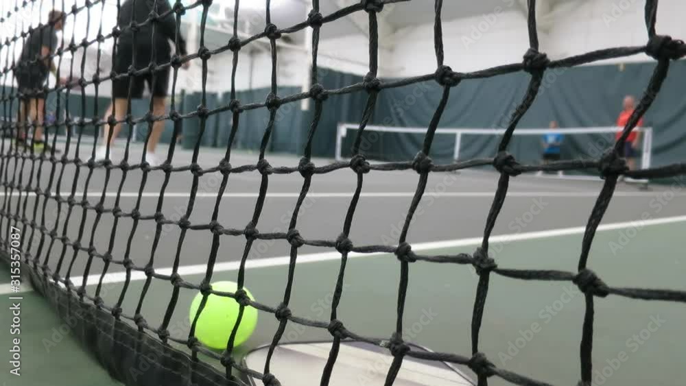 pickleball action is taking place indoors pickleball action is taking place indoors