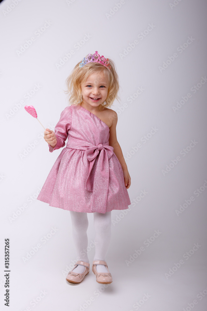 beautiful little blonde girl with a heart shaped Lollipop beautiful little blonde girl with a heart shaped Lollipop