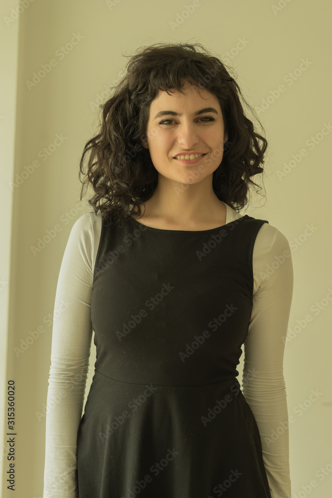 Portrait of a smiling woman in an elegant dress Portrait of a smiling woman in an elegant dress