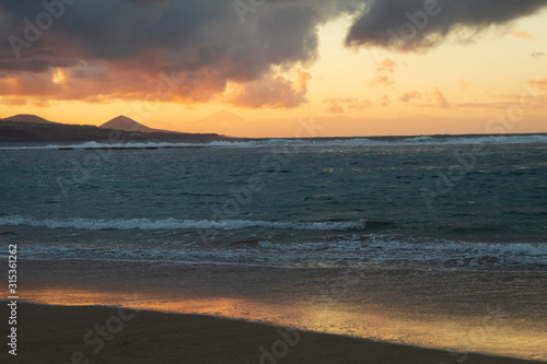Yellow sunset in gran canarias. You can see the Teide volcano