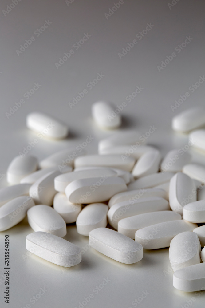 Pills tablets vitamins drugs white close up macro shot Pills tablets vitamins drugs white close up macro shot