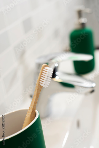 bamboo toothbrush in the bathroom photo