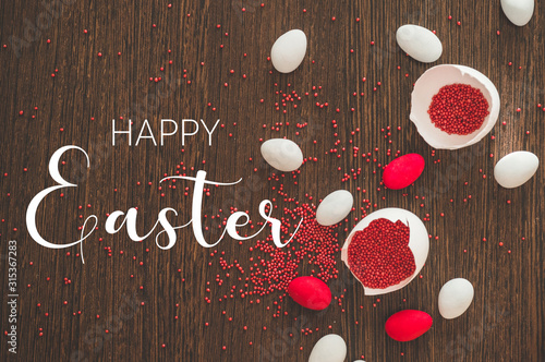 Happy Easter. Flat Lay of Golden Eggs and easter red sprinkle on wooden background