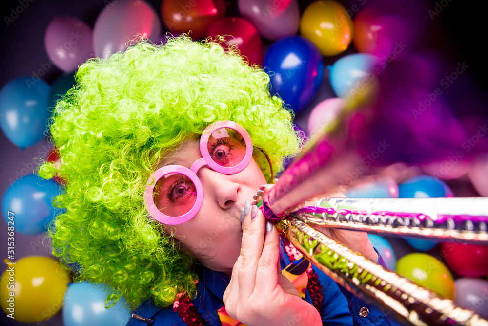 Portrait of beautiful party woman in wig and glasses (Carneval). Portrait of beautiful party woman in wig and glasses (Carneval).